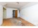 Bedroom with plywood flooring and an doorway showcasing a simple space with renovation and customization at 3316 Fairhaven Rd, Rock Hill, SC 29732