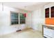 Outdated kitchen, with a window, single cabinet and orange backsplash at 3316 Fairhaven Rd, Rock Hill, SC 29732