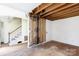 Empty living room showing exposed beams and a staircase at 3316 Fairhaven Rd, Rock Hill, SC 29732