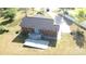 Aerial view shows spacious backyard with deck, brick house, and mature trees at 3555 Tree Line Dr, Rock Hill, SC 29732