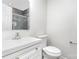 Bright bathroom showcasing a modern white vanity, toilet, and framed mirror with neutral wall color at 3555 Tree Line Dr, Rock Hill, SC 29732
