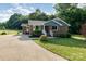 Charming brick home with blue siding accents, landscaped yard, and a concrete driveway at 3555 Tree Line Dr, Rock Hill, SC 29732