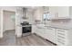 Bright kitchen features shaker cabinets, stainless steel appliances, and gray countertops at 3555 Tree Line Dr, Rock Hill, SC 29732