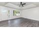 Large living room featuring tray ceilings and access to the front porch at 3555 Tree Line Dr, Rock Hill, SC 29732