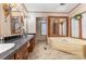 Relaxing bathroom featuring a jetted tub, double sinks, and decorative mirrors at 403 Carpenter Parker Ln, Rock Hill, SC 29730