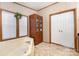 Relaxing bathroom featuring a jetted tub, linen cabinet, and plenty of light at 403 Carpenter Parker Ln, Rock Hill, SC 29730