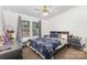 Cozy bedroom featuring a ceiling fan and natural light from two windows at 403 Carpenter Parker Ln, Rock Hill, SC 29730
