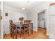 Bright dining area with hardwood floors, a view to the laundry, and space for seating at 403 Carpenter Parker Ln, Rock Hill, SC 29730