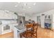 Spacious kitchen with stainless steel appliances, a central island with seating, and hardwood floors at 403 Carpenter Parker Ln, Rock Hill, SC 29730