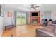 Comfortable living room featuring a fireplace, large window with a view, and hardwood flooring at 403 Carpenter Parker Ln, Rock Hill, SC 29730
