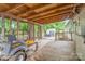 Covered patio area with lawn mower, and access to the yard at 403 Carpenter Parker Ln, Rock Hill, SC 29730