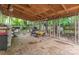 Covered patio area with lawn mower, grill, and unfinished construction at 403 Carpenter Parker Ln, Rock Hill, SC 29730
