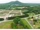 Aerial view of a property surrounded by lush greenery, a sprawling landscape and mountain views at 4098 S Nc Hwy 127 Hwy, Hickory, NC 28602