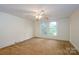 Bright bedroom featuring neutral carpet, a ceiling fan, and natural lighting at 4098 S Nc Hwy 127 Hwy, Hickory, NC 28602