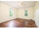 Bright bedroom with hardwood floors and two large windows bringing in natural light at 4098 S Nc Hwy 127 Hwy, Hickory, NC 28602