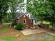Charming brick home with a well-maintained yard and mature trees, featuring a cozy patio area at 4098 S Nc Hwy 127 Hwy, Hickory, NC 28602