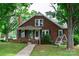 Charming brick home with black shutters, a well-maintained lawn, and mature trees at 4098 S Nc Hwy 127 Hwy, Hickory, NC 28602