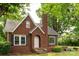 Charming brick home with a gabled roof, arched doorway, and mature trees surrounding at 4098 S Nc Hwy 127 Hwy, Hickory, NC 28602