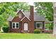 Charming brick home featuring a gabled roof, black shutters, and a cozy front porch at 4098 S Nc Hwy 127 Hwy, Hickory, NC 28602
