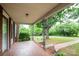 Spacious front porch with brick flooring and views of the lush front yard at 4098 S Nc Hwy 127 Hwy, Hickory, NC 28602