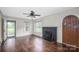 Bright living room with hardwood floors, fireplace, and arched front door at 4098 S Nc Hwy 127 Hwy, Hickory, NC 28602