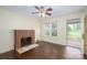 Cozy living room with brick fireplace, hardwood floors, and natural light at 4098 S Nc Hwy 127 Hwy, Hickory, NC 28602