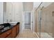 Well-lit bathroom featuring a walk-in shower and stylish sink at 411 Steel Gardens Blvd, Charlotte, NC 28205