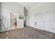 Neutral bedroom with plush carpeting, tv and easy access to bath and closet at 411 Steel Gardens Blvd, Charlotte, NC 28205