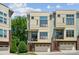 Modern townhome exterior with brick accents and a two-car garage at 411 Steel Gardens Blvd, Charlotte, NC 28205
