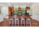 Beautiful kitchen with stainless steel appliances, a breakfast bar, and wood floors at 411 Steel Gardens Blvd, Charlotte, NC 28205