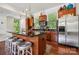 Well-appointed kitchen with stainless steel appliances and a breakfast bar at 411 Steel Gardens Blvd, Charlotte, NC 28205