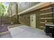This concrete patio has a fenced-in area and a brick exterior wall with a white door at 411 Steel Gardens Blvd, Charlotte, NC 28205