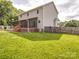 Large backyard with a well-maintained lawn, screened-in porch, and privacy fence at 4111 Jenkins Rd, Marshville, NC 28103