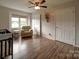 Bedroom featuring a cozy chair, neutral tones, natural light, and a view of the outside at 4111 Jenkins Rd, Marshville, NC 28103