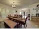 Dining room with large wood table and seating, adjacent to the living room, creating an open entertaining space at 4111 Jenkins Rd, Marshville, NC 28103