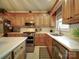 Well-equipped kitchen with stainless steel appliances, wooden cabinets, and ample counter space at 4111 Jenkins Rd, Marshville, NC 28103