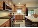 Well-appointed kitchen with stainless steel appliances and counter seating at 4111 Jenkins Rd, Marshville, NC 28103