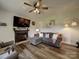 Comfortable living room with a fireplace, plush seating, and a large TV, perfect for relaxing and entertaining at 4111 Jenkins Rd, Marshville, NC 28103