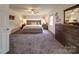Serene main bedroom showcasing a plush bed, soft lighting, and tasteful decor for a relaxing retreat at 4111 Jenkins Rd, Marshville, NC 28103