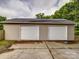 View of two garage doors on an outbuilding with a concrete parking pad at 4111 Jenkins Rd, Marshville, NC 28103