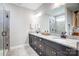 Bathroom showcasing a double sink vanity with granite countertops and modern fixtures at 4116 Spring Cove Way, Belmont, NC 28012