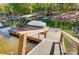 Private boat dock with covered boat slip provides access to the serene lake at 4116 Spring Cove Way, Belmont, NC 28012