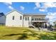 Exterior view of a home with a large backyard, patio and deck at 4116 Spring Cove Way, Belmont, NC 28012