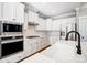 A modern kitchen featuring stainless steel appliances, gas range and white cabinetry at 4116 Spring Cove Way, Belmont, NC 28012
