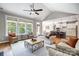 Open-concept living room with hardwood floors, and seamlessly connects to the modern kitchen at 4116 Spring Cove Way, Belmont, NC 28012