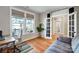 Cozy office space with a comfortable chair, desk, and a large window, allowing ample natural light at 4116 Spring Cove Way, Belmont, NC 28012