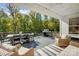 Covered outdoor patio area with grill and dining set perfect for entertaining at 4116 Spring Cove Way, Belmont, NC 28012