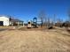 Community playground area with slide, swings, and benches for Gathering fun at 4116 Spring Cove Way, Belmont, NC 28012