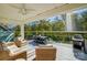 Screened porch with comfortable seating and outdoor dining area at 4116 Spring Cove Way, Belmont, NC 28012