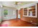 Well-lit sunroom featuring brick walls, tile flooring, and lots of natural light at 4220 Castlewood Rd, Charlotte, NC 28209